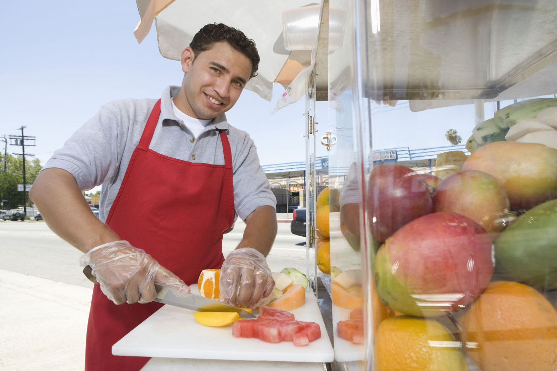 fruitvendor shutterstock 121827016